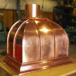 Custom-designed and fabricated copper residential kitchen hood.