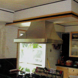 Custom-designed and fabricated stainless steel residential kitchen hood.