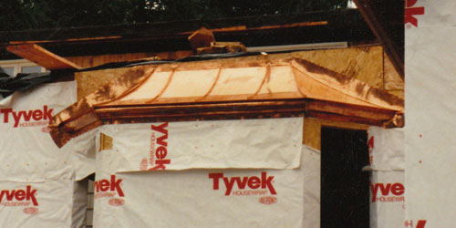Custom-designed copper mansard roofs, hand-fabricated.